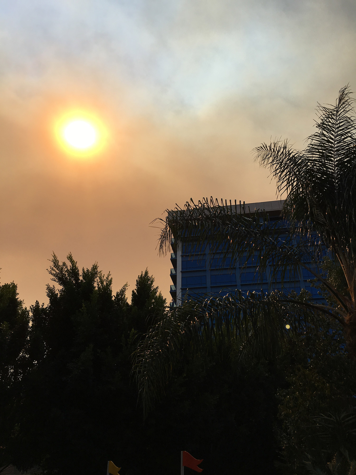 Sun filtering through clouds of smoke from a wildfire near Anaheim